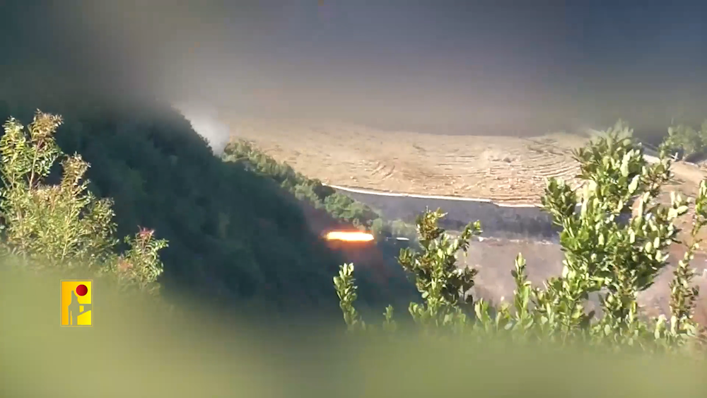 Rockets are fired toward northern occupied Palestine at Israeli occupation military sites from an undisclosed location in Southern Lebanon, October 6, 2024 (Hezbollah military media screengrab)