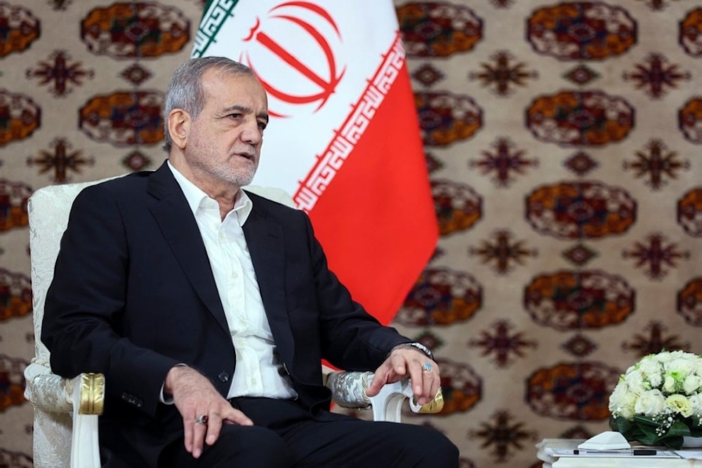 Iranian President Masoud Pezeshkian speaks to Russian President Vladimir Putin in Ashgabat, Turkmenistan, Friday, October 11, 2024 (AP)