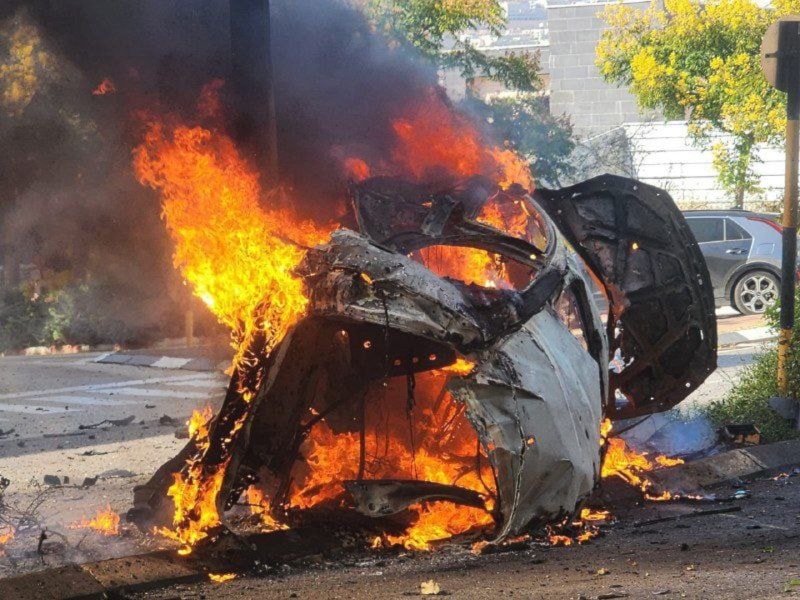 A vehicle is on fire after it was hit by a projectile from the Islamic Resistance in Lebanon in Karmiel, occupied Palestine, October 14, 2024 (Social media)