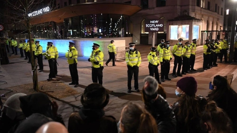 Police officers from a cordon at New Scotland Yard,the headquarters of the Metropolitan Police Service, in central London on March 14,2021. (AFP)