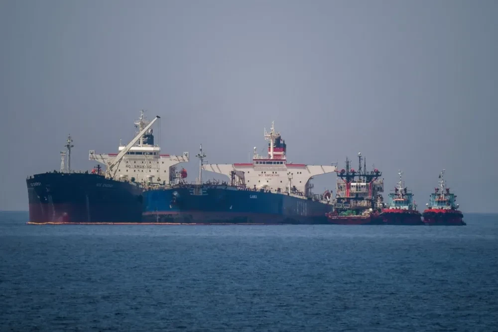 The Liberian-flagged oil tanker Ice Energy (L) transfers crude oil from the Russian-flagged oil tanker Lana (R), off the shore of Karystos, on the Island of Evia, on May 29, 2022. (AFP via Getty Images)