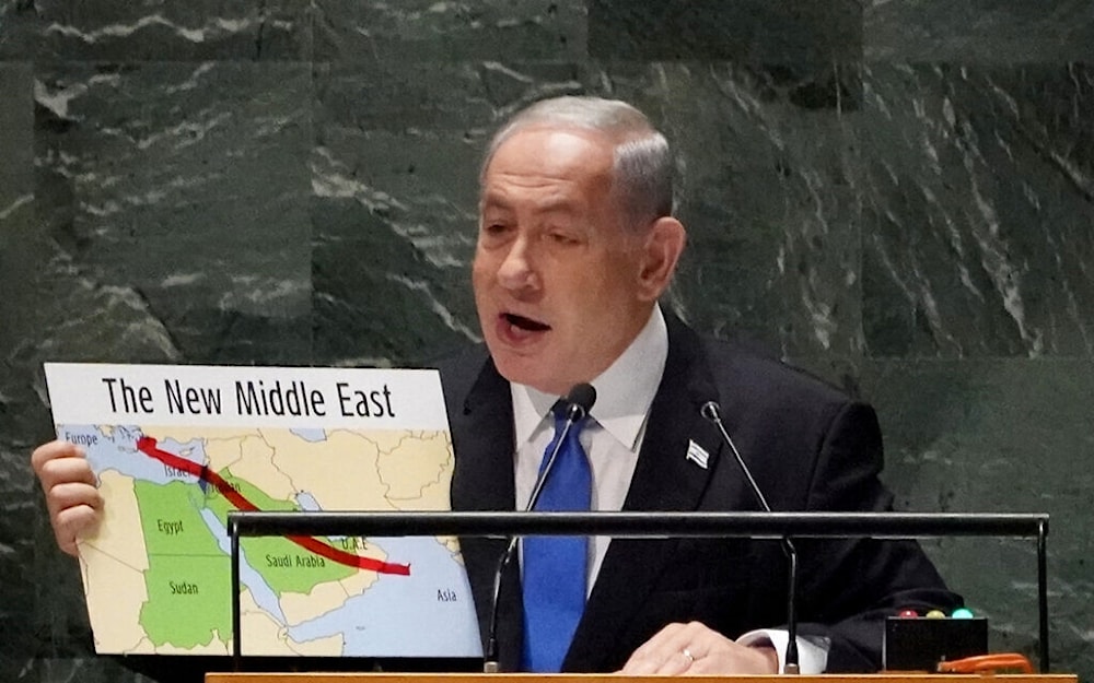  Israeli occupation's Prime Minister Benjamin Netanyahu uses a red marker on a map of 'The New Middle East' as he addresses the 78th session of the United Nations General Assembly, Friday, Sept. 22, 2023. (AFP)