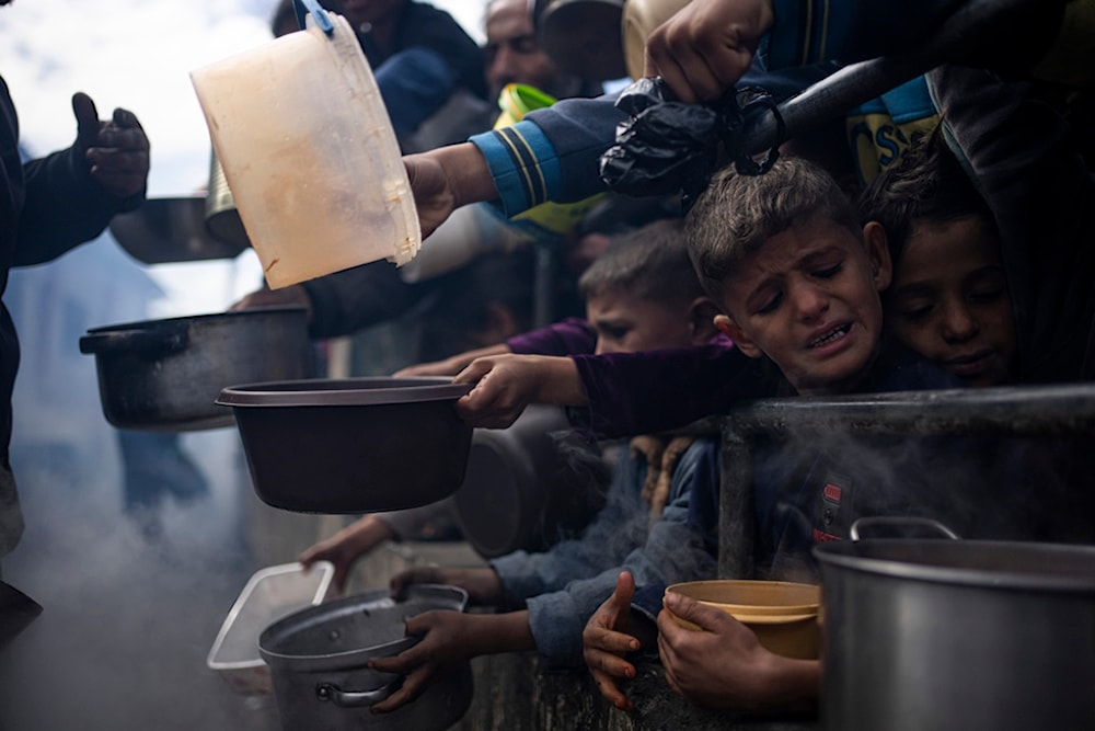 Palestinian children line up for a free meal in Rafah, Gaza Strip, Friday, Feb. 16, 2024. (AP)