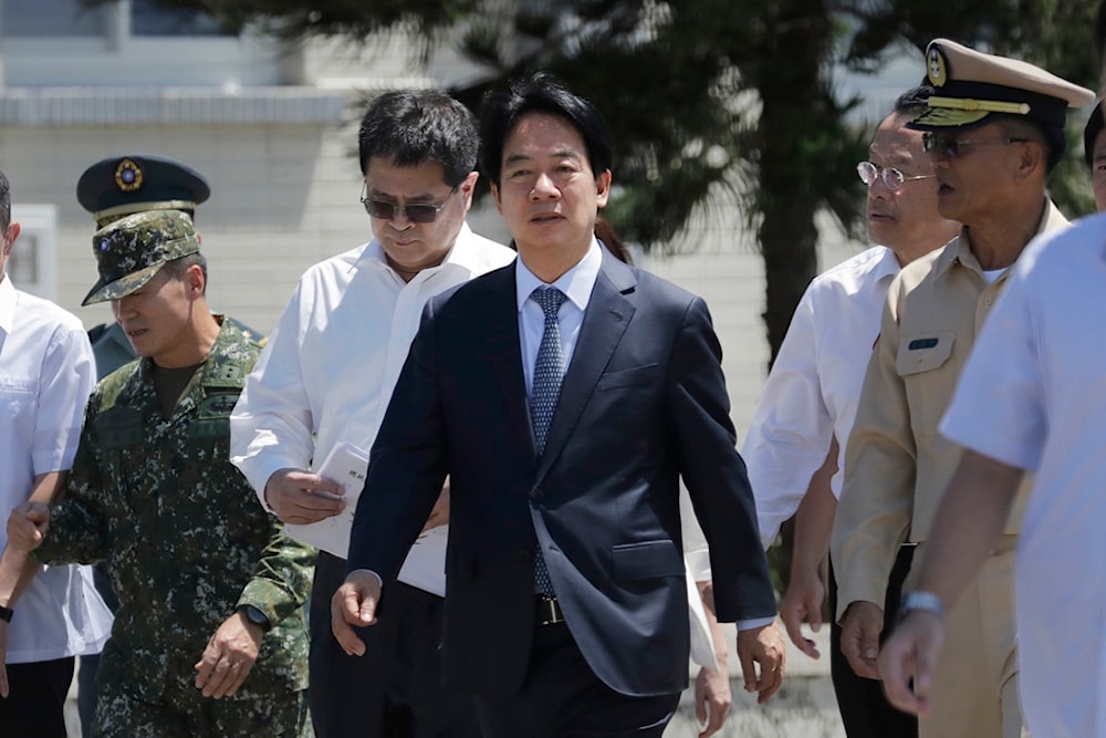 Taiwan President Lai Ching-te, center, listens to a briefing during his visit to inspect Taiwanese navy on the outlying Penghu Island, Taiwan, Sept. 6, 2024. (AP)