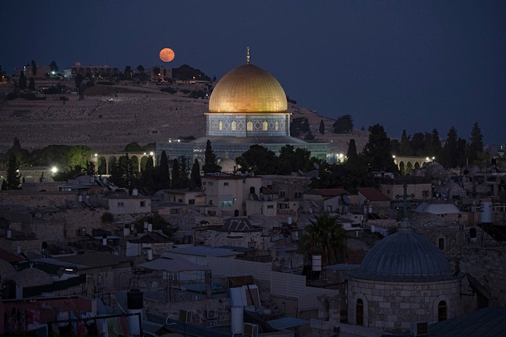 The super moon rises behind the Dome of the Rock shrine at the Al Aqsa Mosque compound in the Old City of al-Quds, Monday, Aug. 19, 2024. (AP)