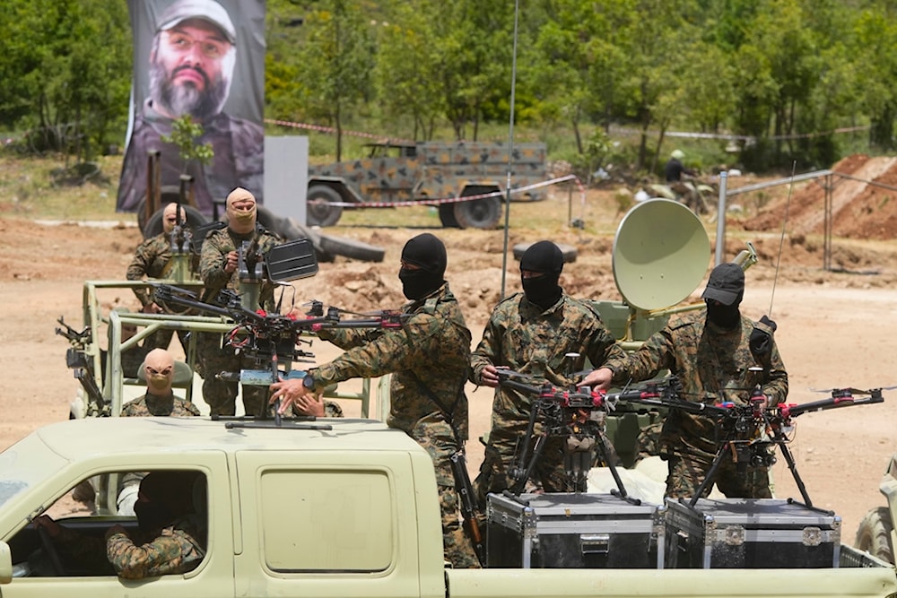 Hezbollah fighters take part in a military exercise with armed drones in Aaramta village in the Jezzine District, southern Lebanon, on May 21, 2023. (AP)