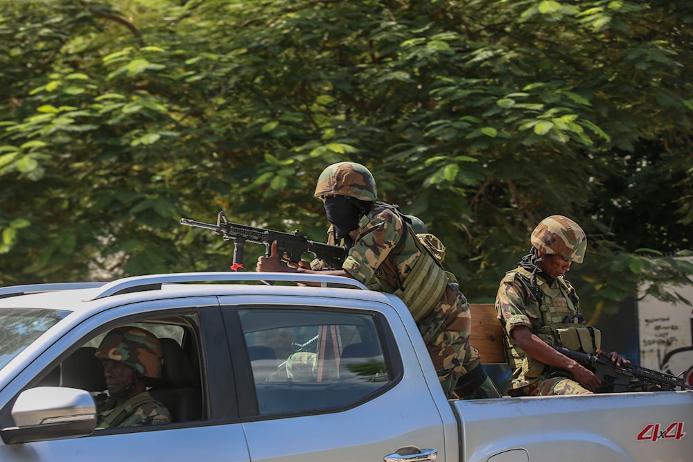 Soldiers patrol amid the sound of gunshots heard in the distance, in Port-au-Prince, Haiti, on October 17, 2024. (AP)