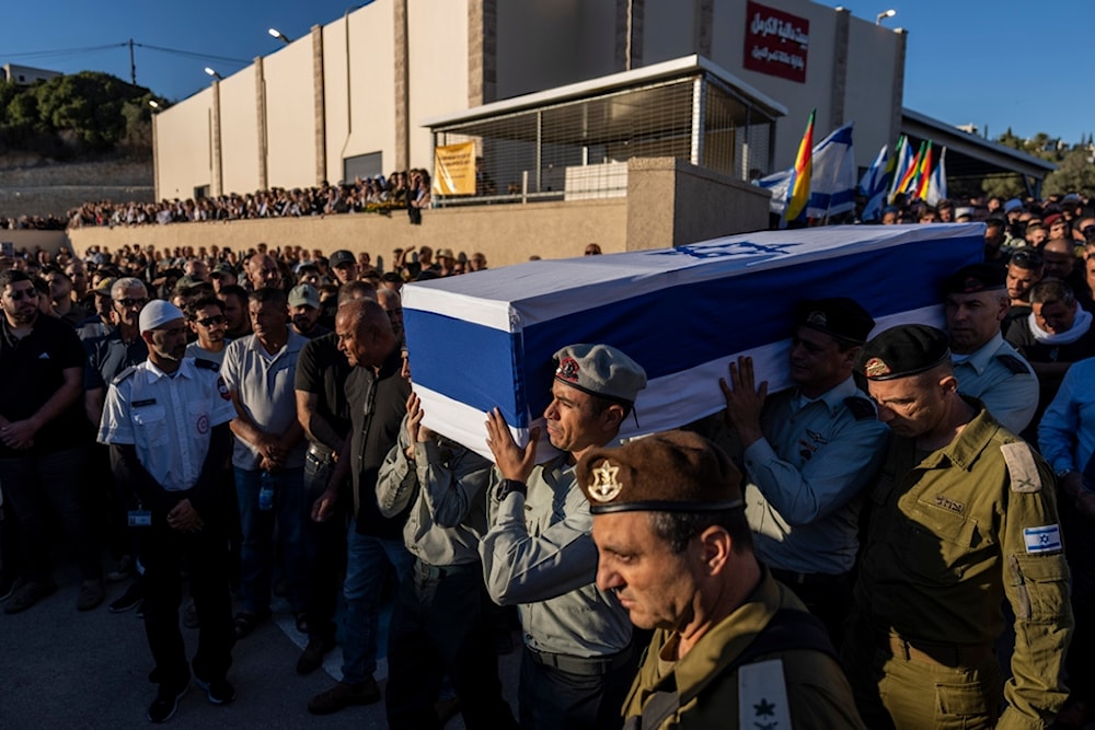 Israeli soldiers carry the flagged-covered coffin of Israeli Druze Colonel, Monday, Oct. 21, 2024, killed during Israel's ground operation in the Gaza Strip (AP)