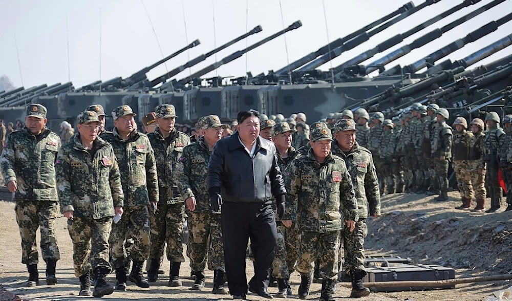 In this photo provided by the DPRK government, leader Kim Jong Un, center, supervises artillery firing drills on March 7, 2024. (Korean Central News Agency/Korea News Service via AP)