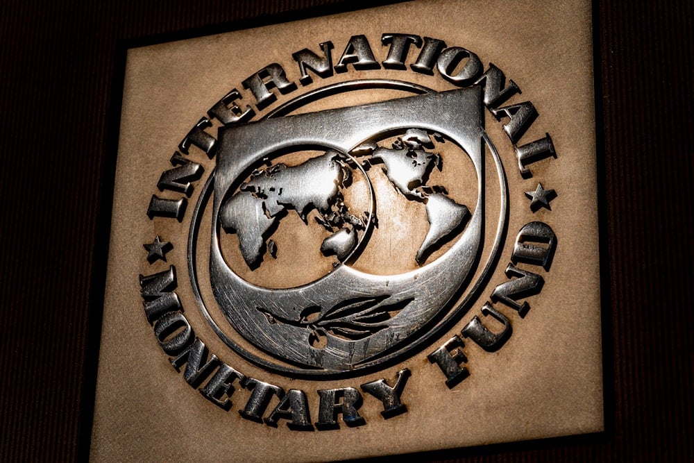  logo of the International Monetary Fund is visible on its building, in Washington on April 5, 2021. (AP)