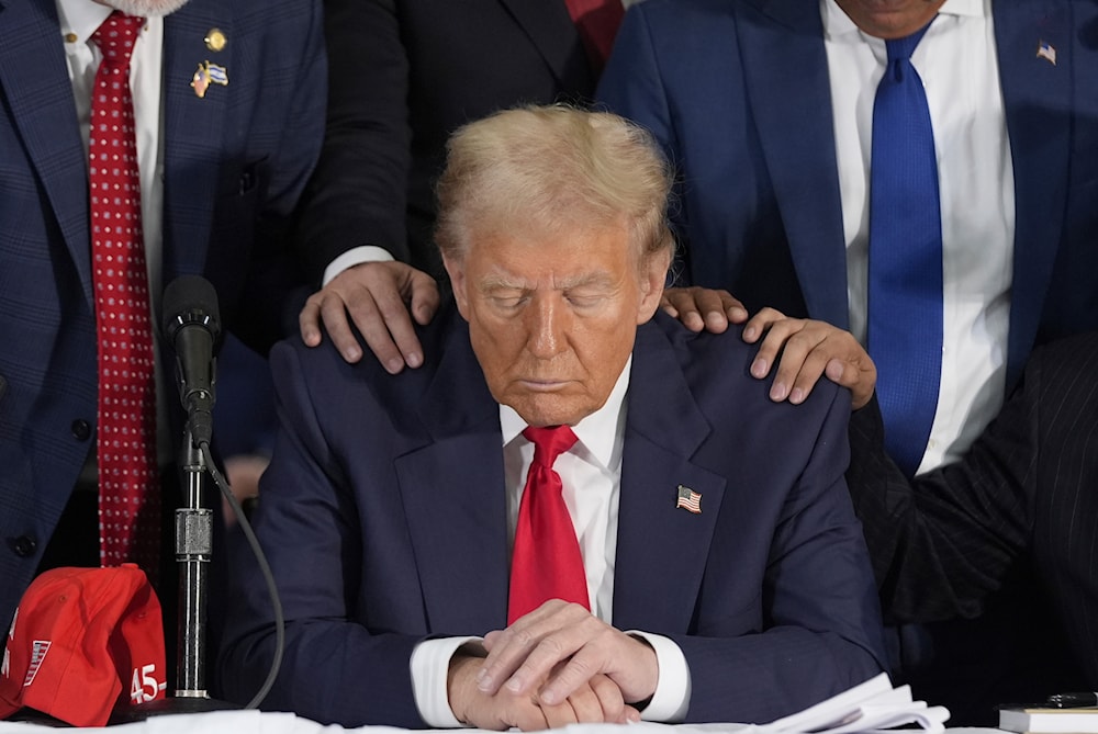 Latino leaders pray with Republican presidential nominee former President Donald Trump as he participates in a Latino leader roundtable, on October 22, 2024 in Doral, Fla. (AP)