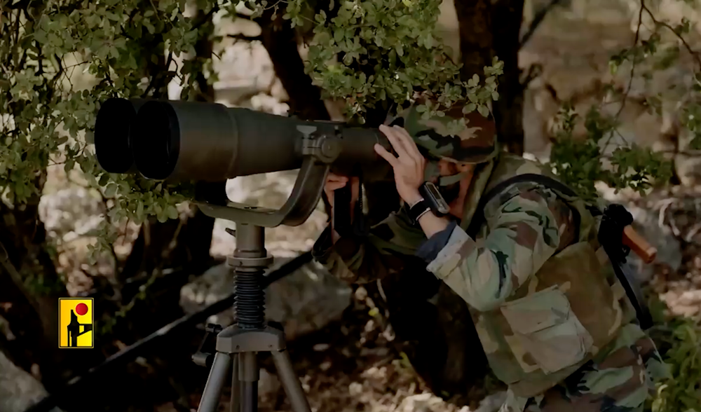 A Hezbollah fighter monitors Israeli movements in an undisclosed location, possibly in southern Lebanon (Undated/Islamic Resistance in Lebanon Military Media)