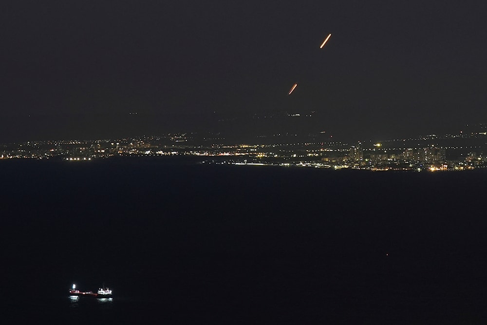 Israeli Iron Dome air defense system fires to intercept rockets that were launched from Lebanon, as seen from Haifa, northern occupied Palestine, on September 26, 2024. (AP)