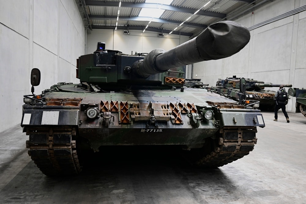 A Leopard 2 tank is seen on the production line as German Chancellor Olaf Scholz and Defense Minister Boris Pistorius visit the future Rheinmetall arms factory site in Unterlüß, Germany. (AP)