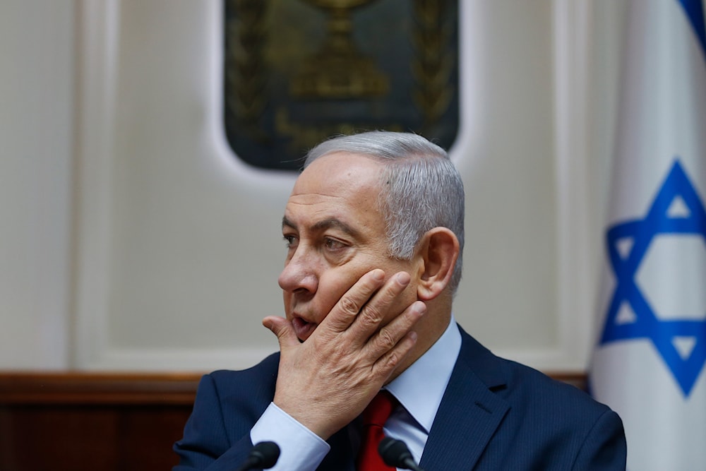 Israeli Prime Minister Benjamin Netanyahu chairs the weekly cabinet meeting at his office in occupied al-Quds, on December 9, 2018. (AP)