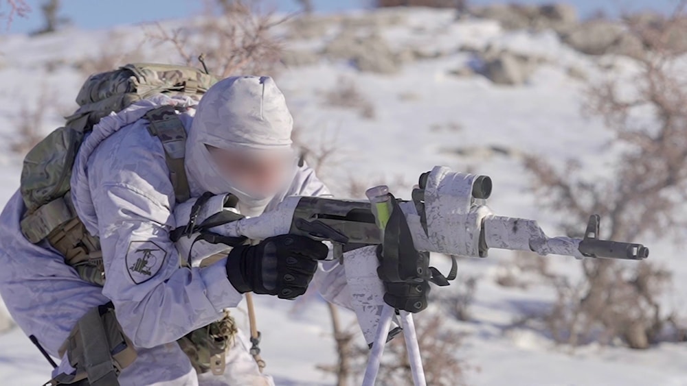 A Hezbollah fighter during military drills in the snow, which was released on February 15, 2022 (Islamic Resistance Military Media)