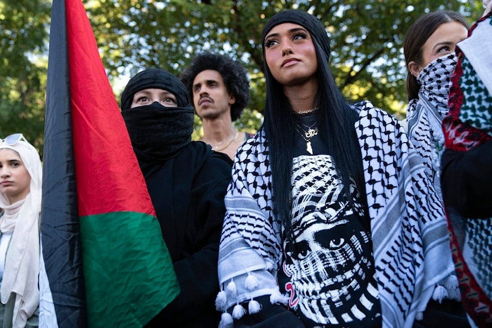 Pro-Palestinian activists protest at Lafayette Park across from the White House to mark the approaching one-year anniversary of the genocide in Gaza, Saturday, October 5, 2024, in Washington (AP)