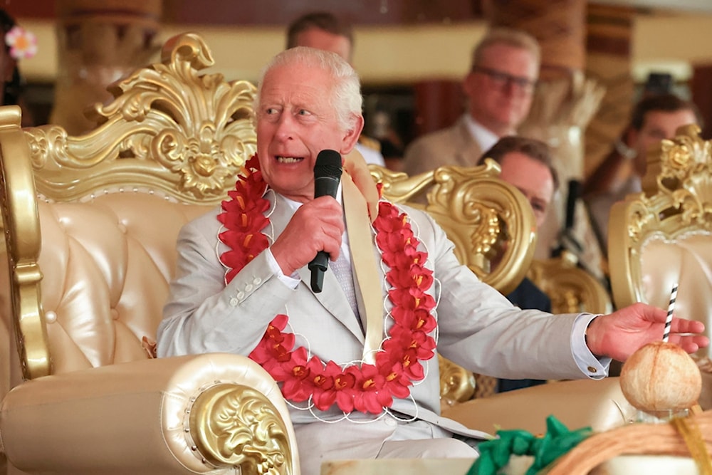 Britain's King Charles III speaks during the bestowing and farewell ceremony on the final day of the royal visit to Samoa at the Siumu Village in Apia, Samoa, Saturday, Oct. 26, 2024. (AP)