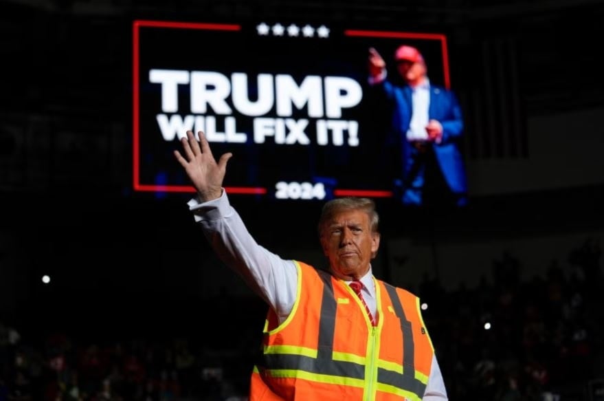  The Republican kept his bright orange safety vest on for his rally in Green Bay, Wisconsin (AP)