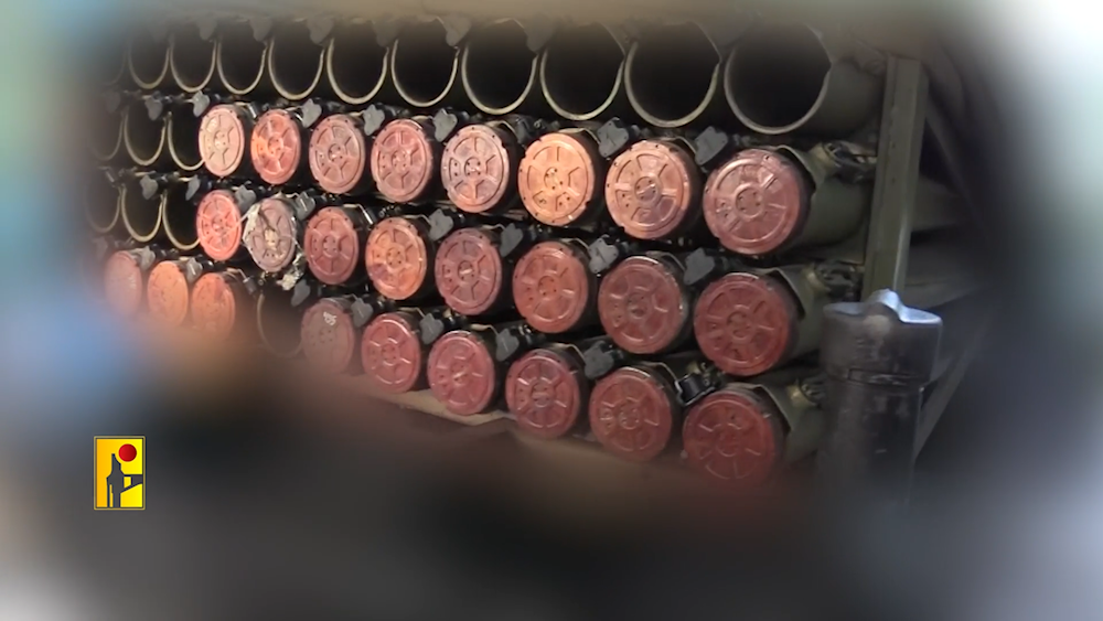 Hezbollah fighters load up rockets to be launched at the settlement of Karmiel in northern occupied Palestine in an undisclosed location southern Lebanon, October 31, 2024 (Islamic Resistance military media)