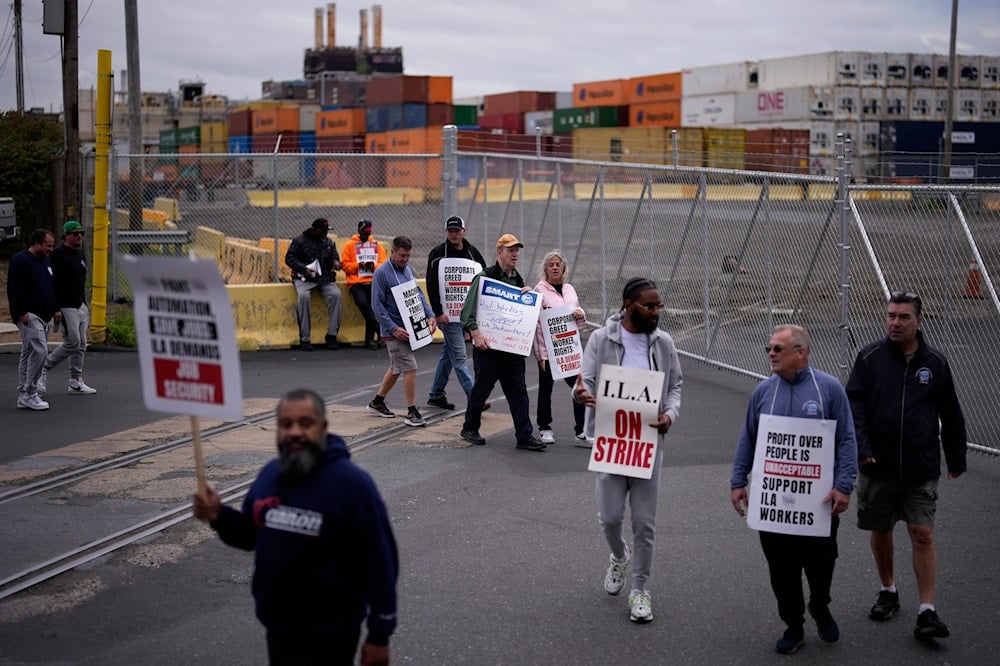 Striking longshoreman picket outside the Packer Avenue Marine Terminal Port, on October 1, 2024, in Philadelphia. (AP)