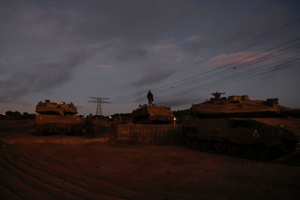 An Israeli soldier stands atop an armoured vehicle in the Golan Heights on September 19, 2024. (AFP)