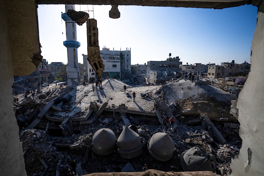 Palestinians look at the destruction after an Israeli strike on residential buildings and a mosque in Rafah, Gaza Strip, on February 22, 2024. (AP)