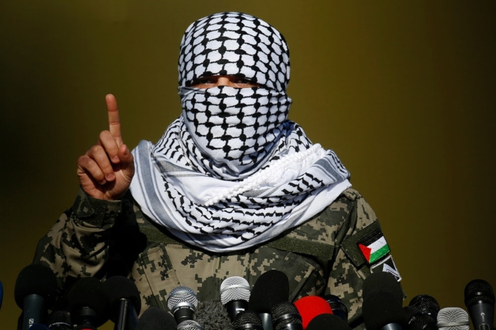 A Palestinian spokesperson for the Palestinian Resistance Joint Operations Room talks during a press conference outside Gaza City, Palestine, on December 29, 2020 (AP) 