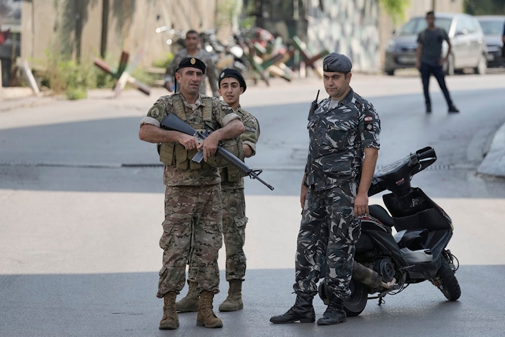 Lebanese security stand guard on a road that leads to the U.S. Embassy in Aukar, a northern suburb of Beirut, Lebanon, Wednesday, June 5, 2024. (AP)