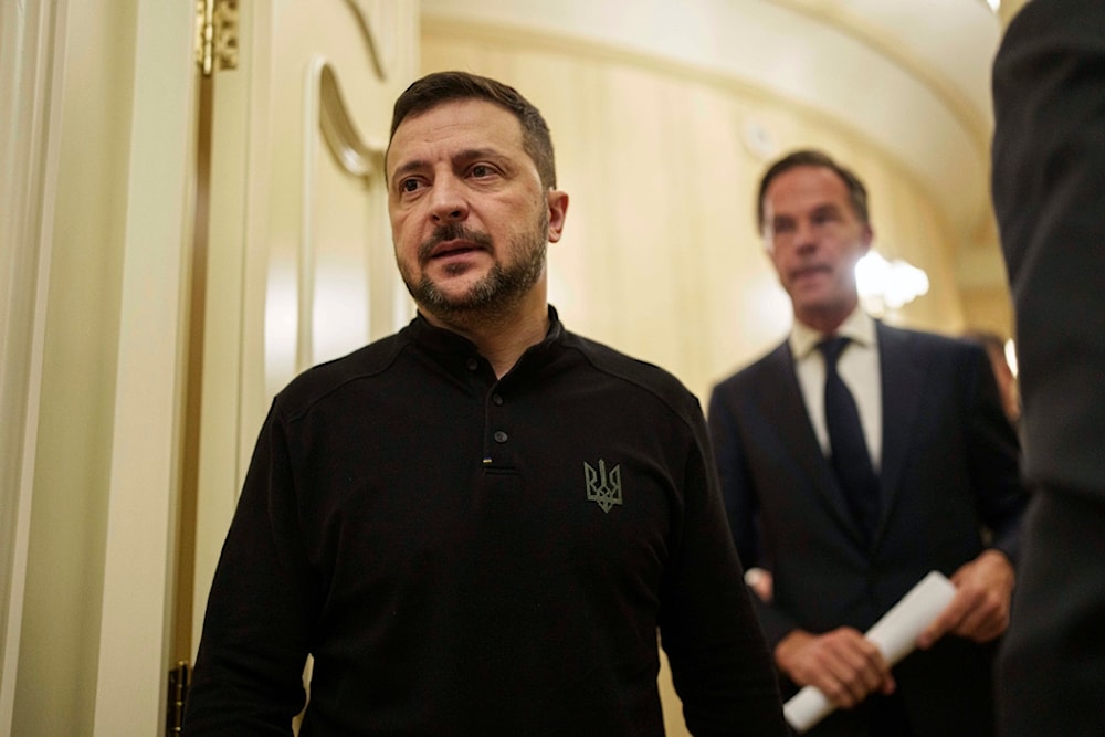 Ukrainian President Volodymyr Zelenskyy, left, and NATO Secretary General Mark Rutte walk in a corridor ahead of a press conference in Kyiv, Ukraine, Thursday Oct. 3, 2024. (AP)