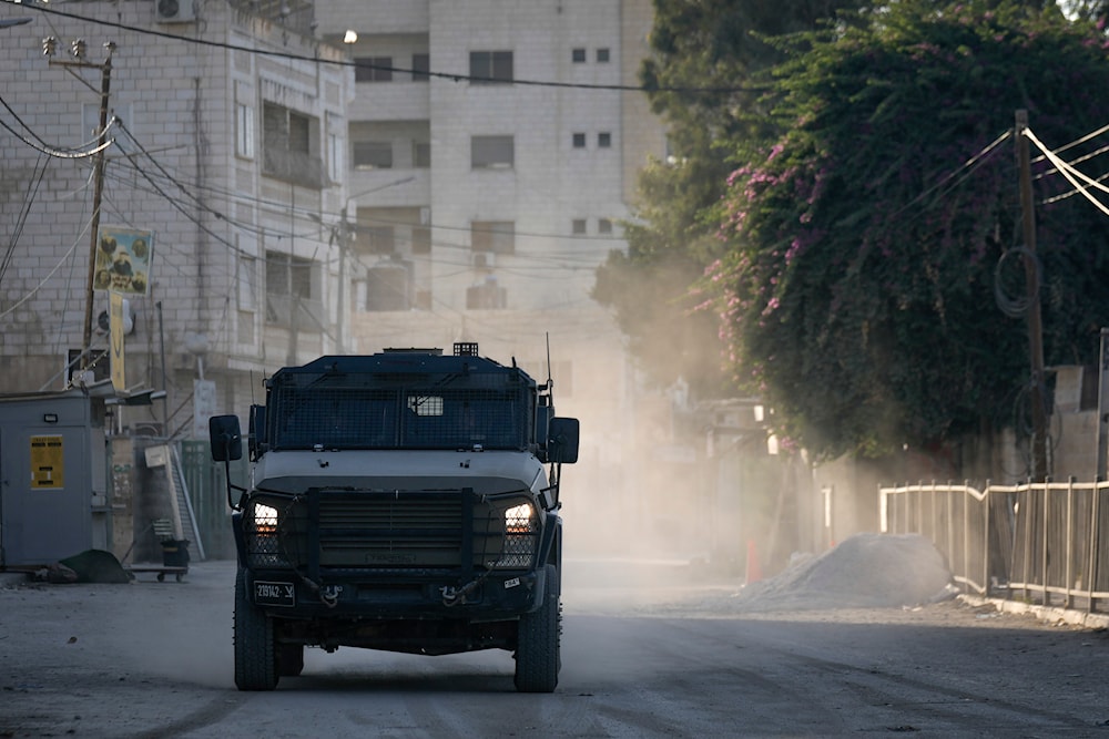 An Israeli armoured vehicle moves on a street during a military operation in the West Bank city of Jenin, on September 25, 2024. (AP)