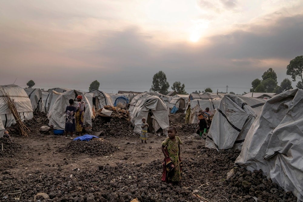 FILE - People displaced by the ongoing fighting gather at refugee camp on the outskirts of Goma, Democratic Republic of the Congo, Thursday, July 11, 2024. (AP Photo/Moses Sawasawa, File)