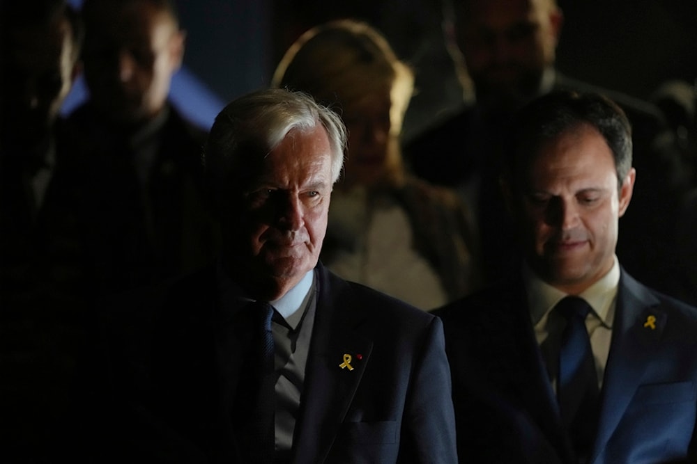 French Prime Minister Michel Barnier, left, at the Palais des Sports in Paris, on Monday, October 7, 2024 (AP)