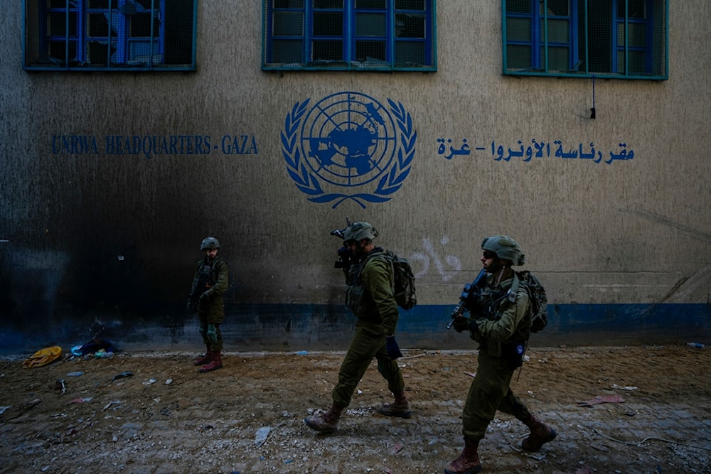 Israeli soldiers take position as they enter the UNRWA headquarter during the ground invasion in Gaza, Thursday, Feb. 8, 2024. (AP)