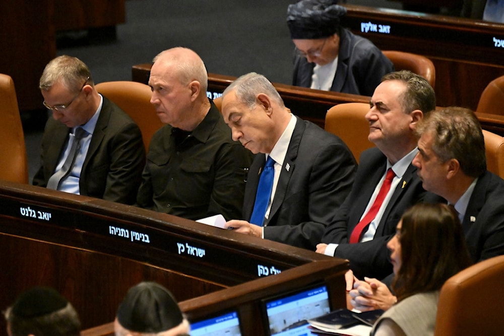 Israeli Prime Minister Benjamin Netanyahu, center, flanked by Security Minister Yoav Gallant, second from left, attends at the opening of the 25th Knesset session, October 28, 2024 (AP)