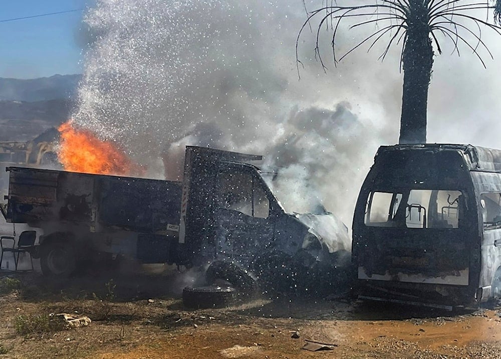 A truck and ambulance burn after Israeli airstrikes hit a group of paramedics outside a hospital in Marjayoun, south Lebanon, Friday, Oct. 4, 2024. (AP)