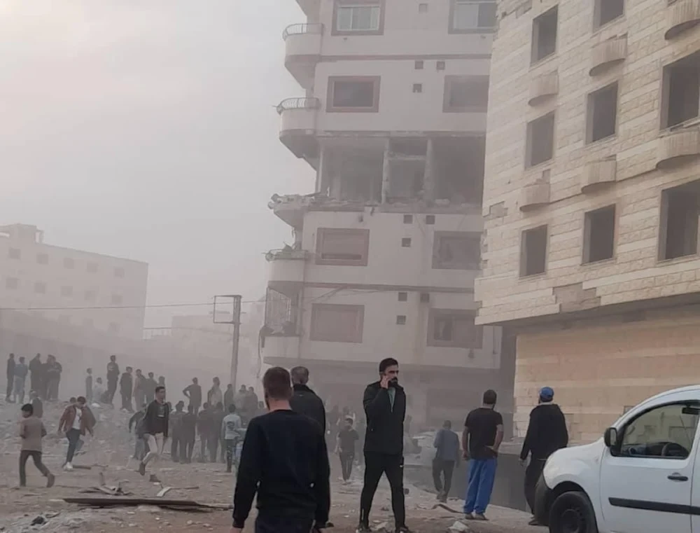 People gather around the area an airstrike hit the Sayyidah Zeinab area of the Syrian capital of Damascus, November 10, 2024 (Social media)