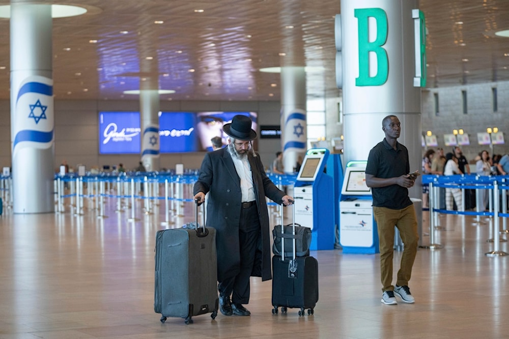 Travelers line up at Ben Gurion International Airport near Tel Aviv, occupied Palestine, Monday Sept. 2, 2024. (AP)