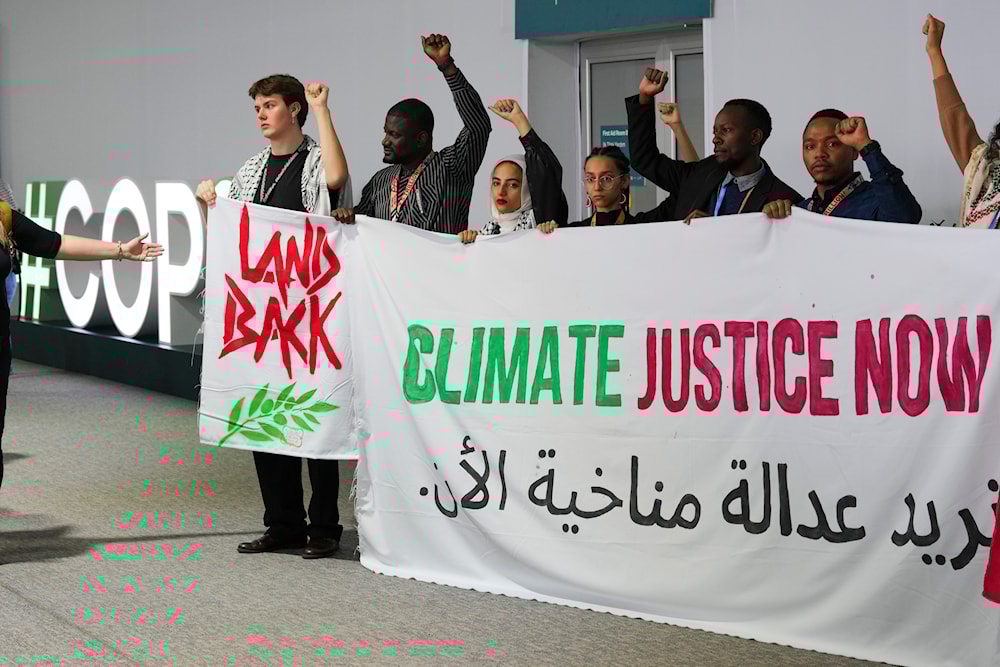 Activists demonstrate for climate justice and a ceasefire in the Israel-Hamas at the COP29 U.N. Climate Summit, on November 11, 2024, in Baku, Azerbaijan. (AP)