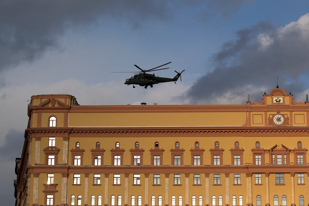 Russian military Mi-35 helicopter takes off from the building of the Federal Security Service (FSB, Soviet KGB successor) in Lubyanskaya Square in Moscow, Russia, on February 26, 2016. (AP)