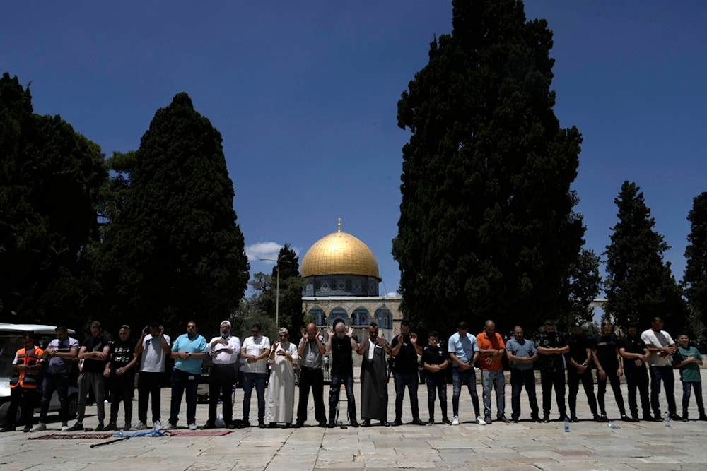 Muslims take part in Friday prayers in the shadow of the Dome of the Rock Mosque in the al-Aqsa Mosque compound in the Old City of al-Quds, occupied Palestine, Friday, August 2, 2024 (AP)