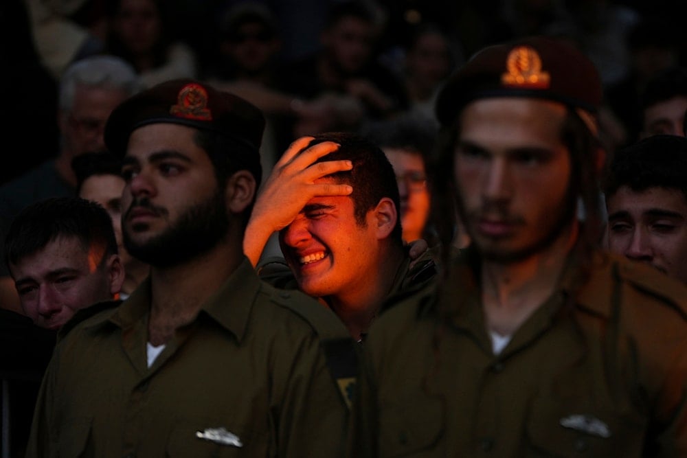 Israeli soldier cries during funeral of a captain killed in action in Lebanon, Thursday, Nov. 14, 2024. (AP)