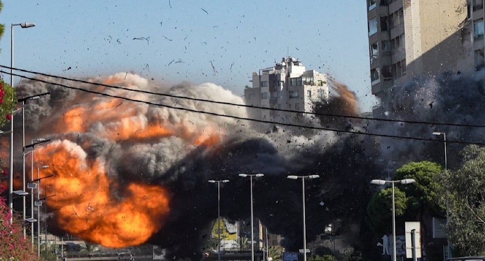 A photo showing an Israeli airstrike as impact is made on a residential building in Beirut's Southern Suburb, undated (Social Media)