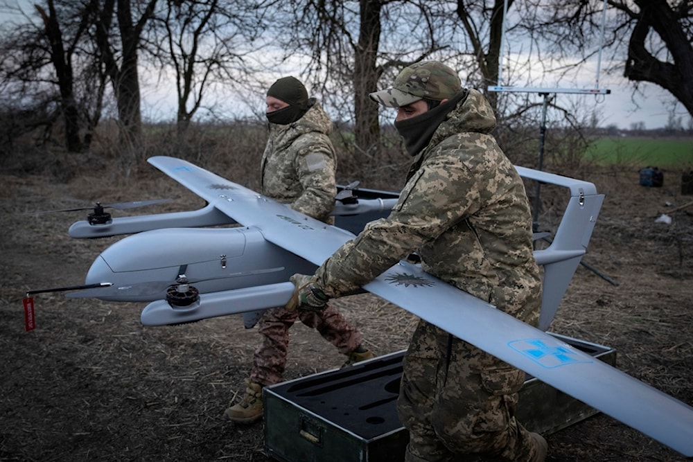 Ukrainian soldiers of the 22nd Mechanised brigade prepare to start the Poseidon H10 Middle-range UAV at the front-line, near Bakhmut, Donetsk region, Ukraine, Tuesday, March 26, 2024. (AP)