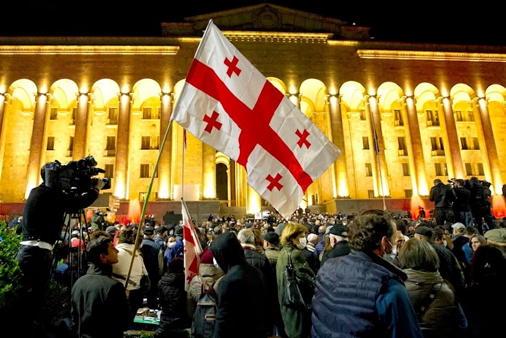 Protesters with Georgian flags rally in Tbilisi, Georgia, Tuesday, Nov. 9, 2021. (AP)