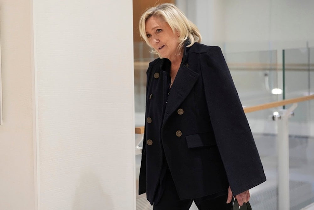 FILE - French far-right leader Marine Le Pen arrives at the courtroom for the trial over the suspected embezzlement of European Parliament funds, Wednesday, Nov. 6, 2024 in Paris. (AP)