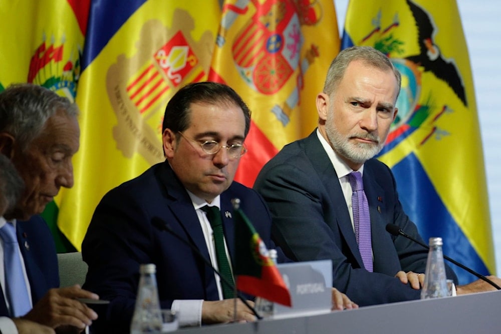 Spain's King Felipe VI, right, and Spanish Foreign Affairs Minister José Manuel Albares, attend at the 29th Ibero-American Summit in Cuenca, Ecuador, Friday, Nov. 15, 2024. (AP)