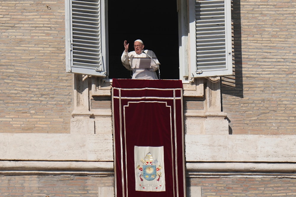 Pope Francis delivers his blessing during the Angelus noon prayer from the window of his studio overlooking St.Peter's Square, at the Vatican, Sunday, November 17, 2024 (AP)