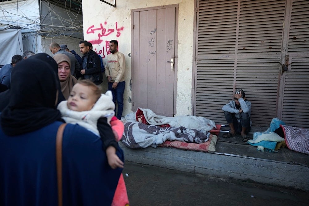 Palestinians mourn nine people killed in an Israeli strike in Bureij refugee camp, Gaza Strip, Friday, Nov. 15, 2024. (AP)