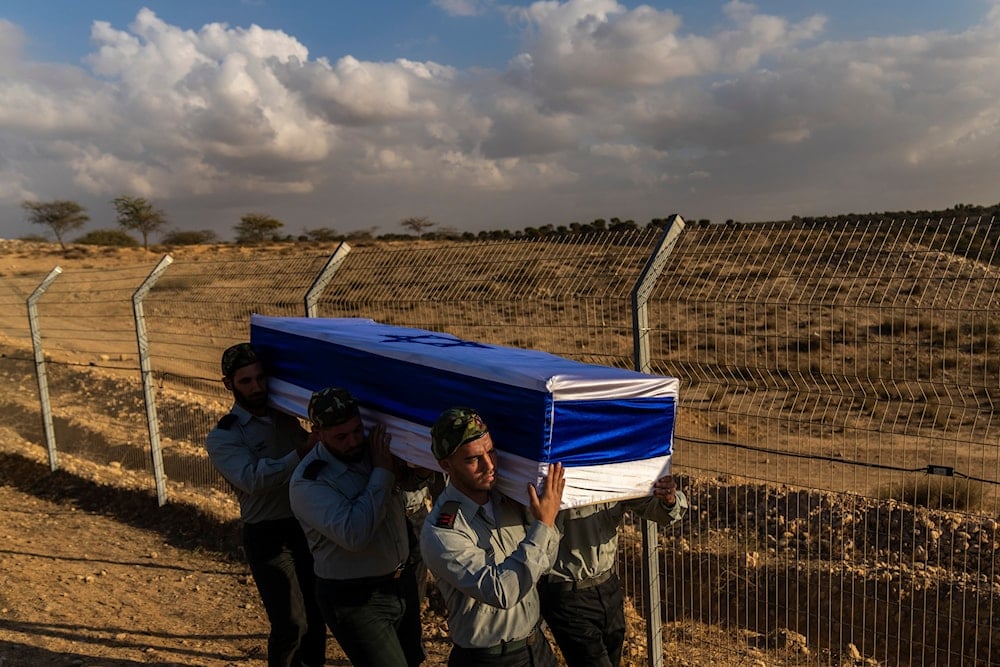 sraeli soldiers carry the coffin of captain Yogev Pazi, who was killed in Gaza, during his funeral at the cemetery of Giv'ot Bar, southern Israel, Monday, Nov. 18, 2024. (AP)